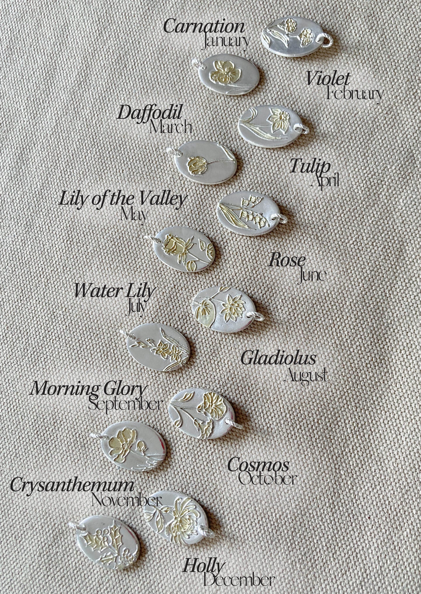 12 fine silver handmade pendants with 12 birth flowers gilded in gold